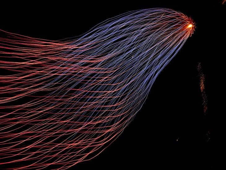 red and blue lights from tower steel wool photography